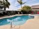 Enjoy the swimming pool with spa, patio, desert landscaping, and outdoor seating areas at 1203 W Mesquite Tree Ln, San Tan Valley, AZ 85143