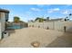 Open backyard featuring a fenced in pool, gravel landscaping, privacy walls, and a small storage bin at 15031 N 37Th Ave, Phoenix, AZ 85053