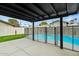 Covered patio overlooking fenced-in pool and low-maintenance yard at 15031 N 37Th Ave, Phoenix, AZ 85053