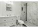 A bathroom features marble tiled walls and modern fixtures at 15031 N 37Th Ave, Phoenix, AZ 85053