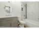 A bathroom features marble tiled walls and modern fixtures at 15031 N 37Th Ave, Phoenix, AZ 85053