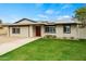 Attractive single-story home with solar panels, well-kept lawn, and a concrete driveway at 15031 N 37Th Ave, Phoenix, AZ 85053