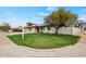Charming single-story home with a well-manicured lawn and mature trees, situated on a corner lot at 15031 N 37Th Ave, Phoenix, AZ 85053