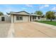 A well-maintained single-story home featuring a spacious driveway and desert landscaping at 15031 N 37Th Ave, Phoenix, AZ 85053