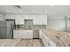 Bright kitchen featuring stainless appliances, granite counters, and tile backsplash at 15031 N 37Th Ave, Phoenix, AZ 85053
