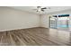Living room with a sliding glass door to the backyard and sparkling swimming pool at 15031 N 37Th Ave, Phoenix, AZ 85053