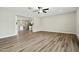 Stylish living room with wood floors and an open-concept design, next to the kitchen at 15031 N 37Th Ave, Phoenix, AZ 85053