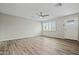 An open living room features wood flooring and natural light at 15031 N 37Th Ave, Phoenix, AZ 85053