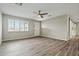 An open living room features wood flooring and natural light at 15031 N 37Th Ave, Phoenix, AZ 85053