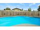 Refreshing in-ground pool surrounded by concrete with a desert landscaped background with privacy wall at 15031 N 37Th Ave, Phoenix, AZ 85053