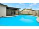 Inviting in-ground pool showcasing its appealing tile trim and secure fenced perimeter at 15031 N 37Th Ave, Phoenix, AZ 85053