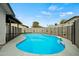 Inviting in-ground pool featuring a tile trim, concrete deck, and secure fencing at 15031 N 37Th Ave, Phoenix, AZ 85053
