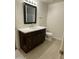 Stylish bathroom with a dark wood vanity, bright countertop, and modern mirror at 1533 W 7Th St, Tempe, AZ 85281