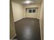 Cozy bedroom featuring dark wood-look floors, bright neutral walls, and a window at 1533 W 7Th St, Tempe, AZ 85281