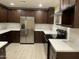 Updated kitchen features sleek stainless steel appliances and stylish cabinetry at 1533 W 7Th St, Tempe, AZ 85281