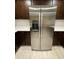 Modern stainless steel refrigerator complemented by rich cabinetry and light countertops at 1533 W 7Th St, Tempe, AZ 85281