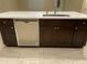 Kitchen island featuring stainless steel dishwasher and dark cabinets at 1533 W 7Th St, Tempe, AZ 85281
