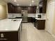 Modern kitchen features stainless steel appliances, dark cabinets, and a spacious kitchen island at 1533 W 7Th St, Tempe, AZ 85281