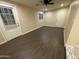 Open floor plan with neutral paint, wood floors, and a door that leads to the backyard at 1533 W 7Th St, Tempe, AZ 85281