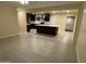 Expansive living space with tile floors that flow into a kitchen featuring a large island at 1533 W 7Th St, Tempe, AZ 85281