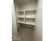 A pantry with beautiful flooring features white shelves for optimal storage at 1533 W 7Th St, Tempe, AZ 85281