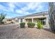 Backyard with desert landscaping, featuring a covered patio perfect for enjoying the outdoors at 15655 W Bethesda Ct, Surprise, AZ 85374