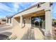 The backyard has a covered patio with desert landscaping and provides shade at 15655 W Bethesda Ct, Surprise, AZ 85374