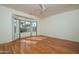 Spacious bedroom with hardwood floors, a large bay window, and abundant natural light at 15655 W Bethesda Ct, Surprise, AZ 85374