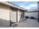 Inviting front entrance featuring a walkway leading to the front door, desert landscaping, and neutral colors at 15655 W Bethesda Ct, Surprise, AZ 85374