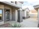 Inviting front entrance featuring a walkway leading to the front door, desert landscaping, and neutral colors at 15655 W Bethesda Ct, Surprise, AZ 85374