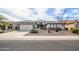 Charming single-story home featuring a well-manicured desert landscape, neutral tones, and a two car garage at 15655 W Bethesda Ct, Surprise, AZ 85374