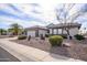 Charming single-story home featuring a well-manicured desert landscape, neutral tones, and a two car garage at 15655 W Bethesda Ct, Surprise, AZ 85374