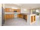 Well-lit kitchen showcasing modern appliances, generous counter space, and a custom wine rack detail at 15655 W Bethesda Ct, Surprise, AZ 85374