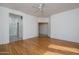 Large main bedroom featuring hardwood floors and entrances to the bathroom and walk-in closet at 15655 W Bethesda Ct, Surprise, AZ 85374