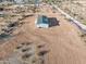 Desert home featuring a concrete patio and a green roof at 164 S Oak Rd, Maricopa, AZ 85139