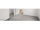 Empty bedroom with light gray carpet and neutral walls at 164 S Oak Rd, Maricopa, AZ 85139