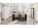 Modern kitchen with a central island, stainless steel appliances, and elegant countertops at 164 S Oak Rd, Maricopa, AZ 85139