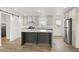 Spacious kitchen featuring a central island, stainless steel appliances, and contemporary design at 164 S Oak Rd, Maricopa, AZ 85139