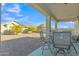 Spacious backyard featuring a covered patio, low-maintenance landscaping, and mature trees at 18230 E El Viejo Desierto --, Gold Canyon, AZ 85118