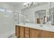 Bathroom featuring a double sink vanity, large mirror, and a glass-enclosed shower at 18230 E El Viejo Desierto --, Gold Canyon, AZ 85118