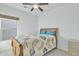 Cozy bedroom featuring a comfortable bed with a leafy comforter and a ceiling fan at 18230 E El Viejo Desierto --, Gold Canyon, AZ 85118