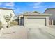 Charming single-story home with a two-car garage, desert landscaping, and a well-maintained front yard at 18230 E El Viejo Desierto --, Gold Canyon, AZ 85118