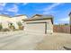 Single-story home with a two-car garage, driveway, walkway, desert landscaping, and side yard gate at 18230 E El Viejo Desierto --, Gold Canyon, AZ 85118