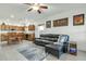 Inviting open-concept living room with a comfortable leather sofa connected to the kitchen area at 18230 E El Viejo Desierto --, Gold Canyon, AZ 85118
