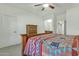 Bright main bedroom showcasing a wooden dresser and colorful patterned quilt at 18230 E El Viejo Desierto --, Gold Canyon, AZ 85118
