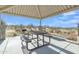 Covered picnic area with a table, benches, and grill, offering a perfect spot for outdoor dining and relaxation at 18230 E El Viejo Desierto --, Gold Canyon, AZ 85118
