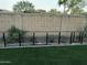 Backyard view featuring a fenced-in garden area with artificial grass and desert plants at 1919 E Gary Way, Phoenix, AZ 85042