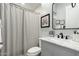 Stylish bathroom featuring a vanity with marble countertop, black hardware, and modern fixtures at 1919 E Gary Way, Phoenix, AZ 85042