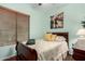 This bedroom features carpeted floors, wood blinds and an art piece at 1919 E Gary Way, Phoenix, AZ 85042