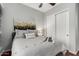 Cozy bedroom featuring carpet floors and a bed with a decorative pillow and an art piece above at 1919 E Gary Way, Phoenix, AZ 85042